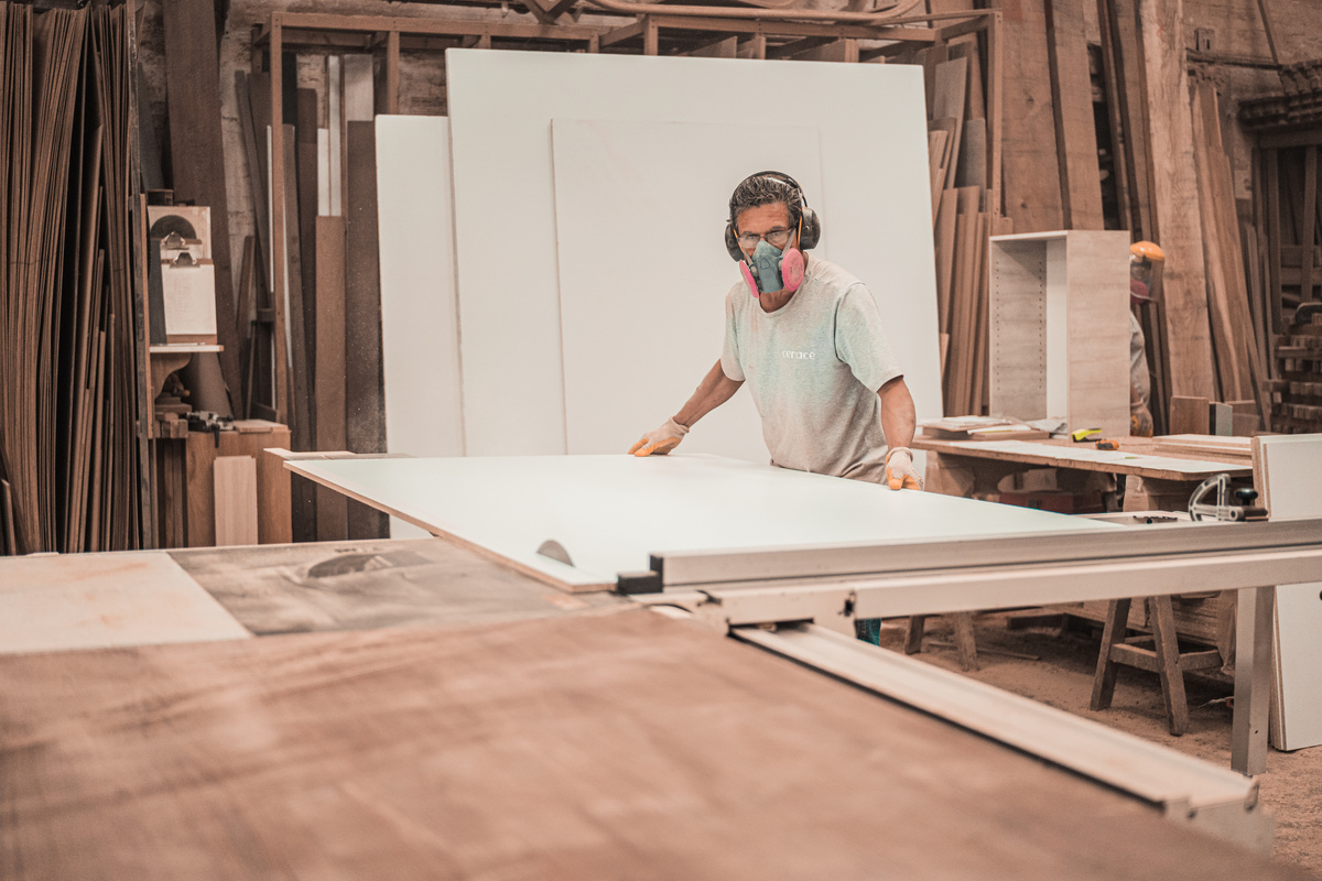 Man Working on a Wooden Board